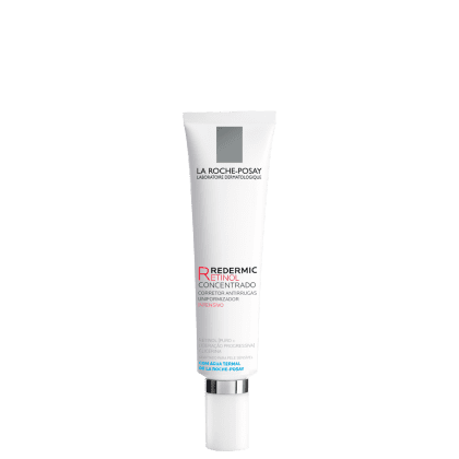 Embalagem em tubo plástico branco com detalhes em cinza e vermelho. Rótulo indica que é um "Redermic Retinol Concentrado", um corretivo antirrugas uniformizador intensivo.