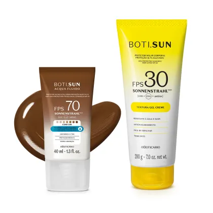 Dois produtos de proteção solar da marca Boti Sun: um frasco de protetor solar facial FPS 70 Cor 08 em bisnaga marrom e branca e uma frasco protetor solar corporal FPS 30 em bisnaga amarela e branca com tampa amarela.