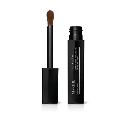 Frasco preto de corretivo líquido da marca Make B. Retinol³ H+ aberto e tampa com aplicador visível na cor preta com ponta em espuma aveludada na cor do produto.