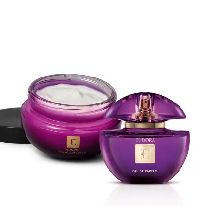 Frasco de perfume Eudora em tom roxo com tampa dourada e pote de creme hidratante Eudora também em embalagem roxa, ambos com logotipo da marca.