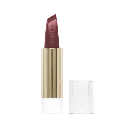 Na imagem o Batom Eudora Glam Amulips na cor Vinho Atitude, um tom de vinho. O batom está aberto, revelando seu interior com o nome Eudora gravado no produto. A embalagem dourada transmite a elegância e qualidade do produto.