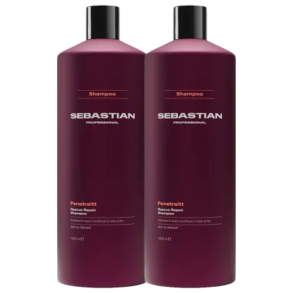 Dois frascos de shampoo da marca Sebastian Professional, na cor vinho escuro, com rótulos destacando o nome da marca e o nome do produto "Penetraitt Rescue Repair Shampoo".