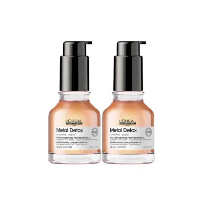Dois frascos de óleo concentrado profissional da linha Metal Detox da L'Oréal Professionnel, com embalagem preta e laranja, contendo 50 ml cada.