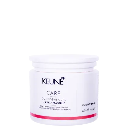O produto apresentado é um pote branco da marca Keune, contendo uma máscara para cabelos encaracolados chamada "Confident Curl Mask". O pote possui uma tampa branca e contém 200 ml do produto.