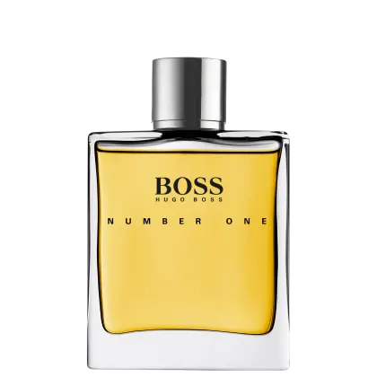 A imagem mostra o perfume Hugo Boss Number One em um frasco retangular transparente com líquido amarelo e tampa prateada cilíndrica. O rótulo preto exibe o texto "BOSS HUGO BOSS NUMBER ONE" em letras brancas.