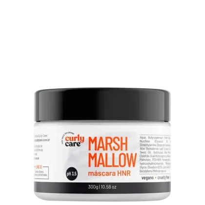 É um produto de tratamento capilar da marca Curly Care. A embalagem é um pote plástico branco com tampa preta. Na frente, há o nome do produto "MarshMallow" em letras grandes e laranjas, seguido de "máscara HNR" em letras menores.