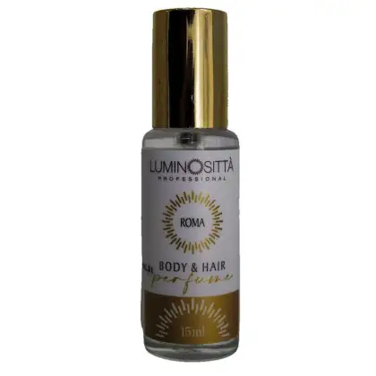 Apresenta pequeno frasco de perfume para corpo e cabelos da marca Luminositta Professional. O frasco é branco, com detalhes em dourado.