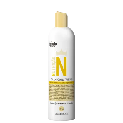 Shampoo nutritivo em frasco plástico branco de 300ml. Rótulo com texto "Nutricao N" em letras amarelas e coroa estilizada acima. Descrição dos ingredientes como avelã, abacate e pracaxi. Indica ser vegano, livre de crueldade e liberado. Detalha pH 4,5.