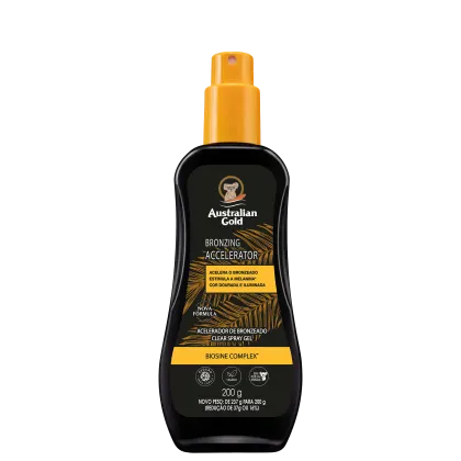 Bronzeador Spray Gel com rótulo amarelo e texto "Australian Gold Bronzing Accelerator". O frasco contém um produto de bronzeamento em spray com fórmula Biosine Complex, indicado para acelerar o bronzeado.