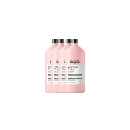 Quatro frascos de condicionador profissional da linha Vitamino Color da L'Oréal Paris, com embalagem rosa clara e rótulos pretos destacando o nome do produto.