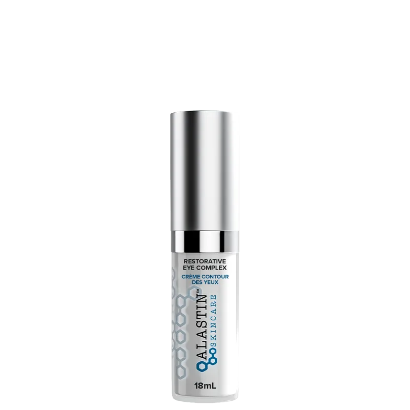 Sérum para a área dos olhos de Alastin. Embalagem cilíndrica de metal prateado. Rótulo na parte inferior com o texto "Restorative Eye Complex" e "Crème Contour des Yeux" em letras pretas sobre fundo branco.