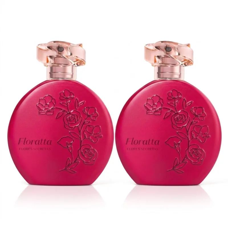 Dois frascos de item de perfumaria da marca Floratta Flores Secretas em formato redondo, cor rosa vibrante opaco com detalhes em relevo com flores estilizadas e tampa em acrílico rosado transparente e borrifador dourado posicionados lado a lado.