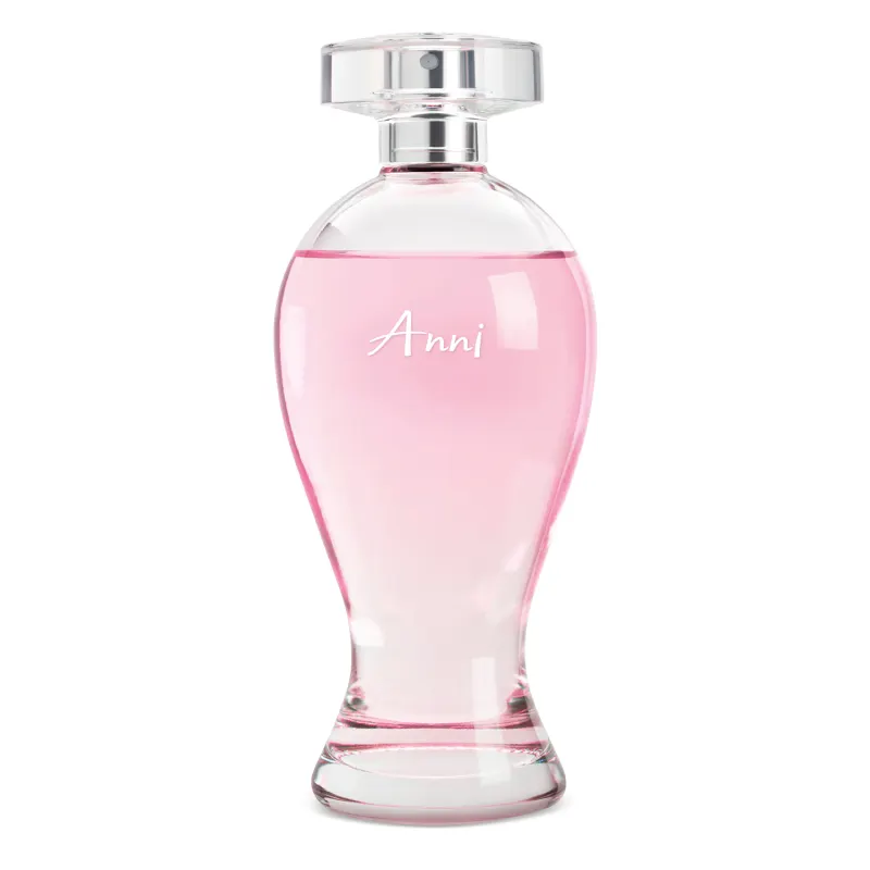 Vidro transparente em formato curvilíneo com líquido rosa, pulverizador prateado e tampa transparente contendo 200ml de desodorante colônia Boticollection Anni.
