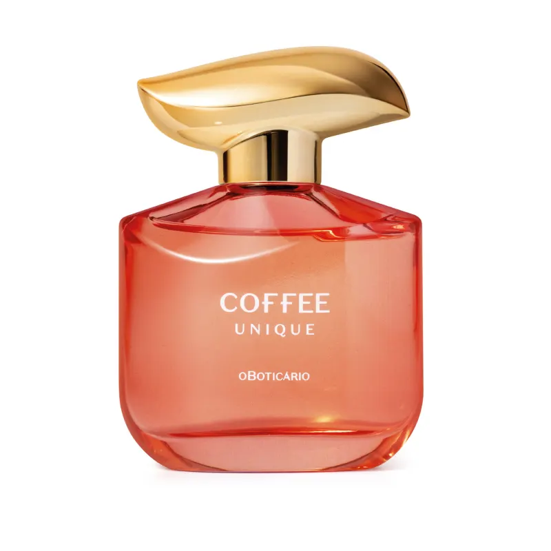 Frasco de item de perfumaria da marca Coffee Woman Unique, com formato arredondado e tampa dourada, em cor vermelha predominante, com texto "Coffee Unique" e "oBoticario" legível no rótulo.
