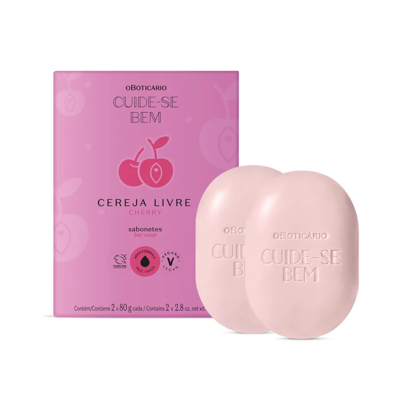 Caixa roxa com letras pretas e cerejas rosa ilustradas ao lado de dois sabonetes em barra brancos em formato ovalado da marca Cuide-se Bem Cereja Livre, contendo 80g cada um.