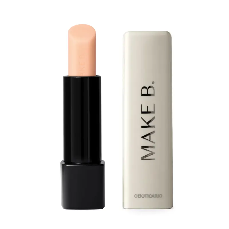 O produto exibido na imagem é um balm labial noturno da marca Make B. Lip Chronology Night Plump. A embalagem é composta por um tubo preto com uma tampa branca. O produto em si possui uma cor bege clara e suave.
