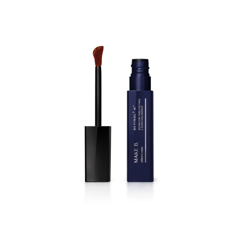 Frasco de batom líquido da marca Make B. com aplicador em formato de pincel com ponta aveludado na cor do produto, em embalagem azul escura com texto em branco.