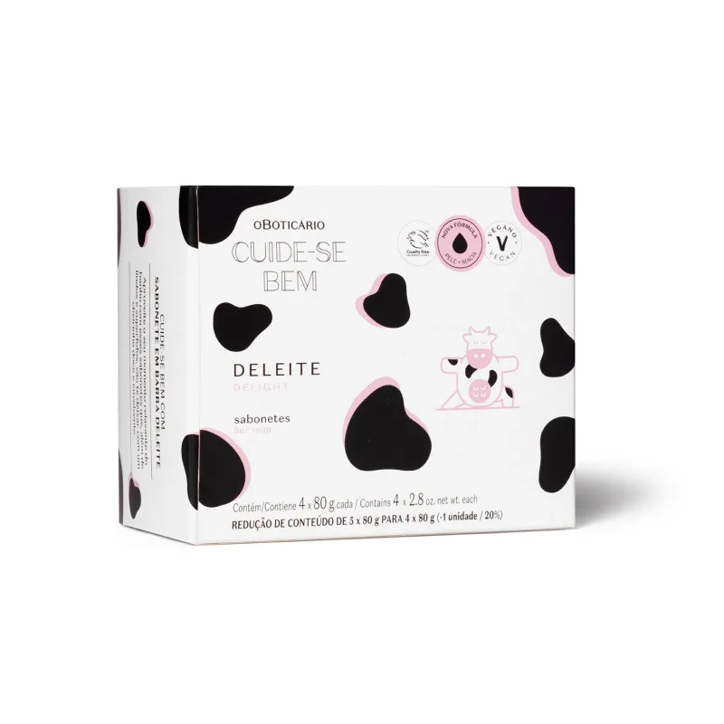 Imagem de caixa branca com manchas pretas e rosa com ilustração de vaca, contendo quatro sabonetes em formato ovalado da marca Cuide-se Bem Deleite.