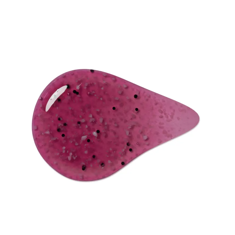 Textura arroxeada, brilhante e granulada de item de sabonete esfoliante corporal, com pequenos pontos.
