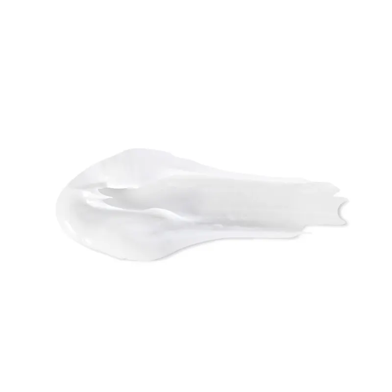 Objeto branco com textura suave e brilhante, com aparência cremosa e delicada. Possui formato irregular e assimétrico, sugerindo tratar-se de um item de  corpo e banho