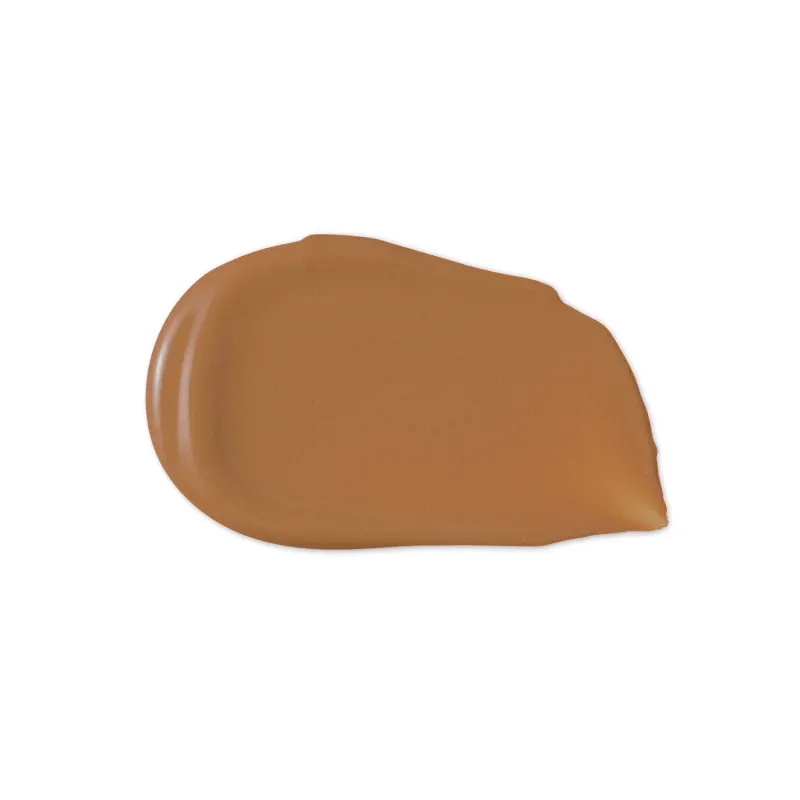 O produto de beleza apresenta uma textura cremosa e brilhante, com uma coloração marrom dourada uniforme. Sua aparência sugere uma consistência suave e aveludada, típica de produtos de maquiagem de alta qualidade.