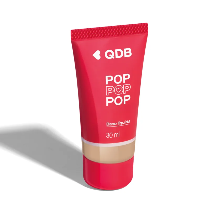 Imagem da base líquida soft matte da marca POP Quem Disse, Berenice? na cor 120N, em tubo rosa com parte transparente, mostrando a tonalidade do produto, e rótulo com letras brancas. O fundo da imagem é branco com sombreado.
