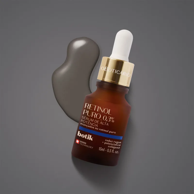 Ambiente de produto de beleza da marca Oboticario, com um retinol puro 0,3% em embalagem de vidro marrom e conta-gotas, em um fundo cinza escuro, destacando a eficácia e a tecnologia suíça do produto.