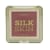 Blush em pó Ruby Rose, com o nome "Silk Skin" impresso em letras grandes. A embalagem é retangular, com uma tampa transparente que permite visualizar o conteúdo. A cor predominante do blush é um tom rosado escuro.