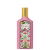 Frasco de perfume Gucci Flora com design floral colorido em fundo rosa, com rótulo dourado destacando o nome da fragrância "Gorgeous Gardenia".