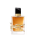 Frasco de perfume Yves Saint Laurent com design elegante em preto e dourado. Recipiente de vidro transparente contendo líquido âmbar, com tampa e detalhes metálicos dourados. Rótulo com logotipo da marca em destaque.