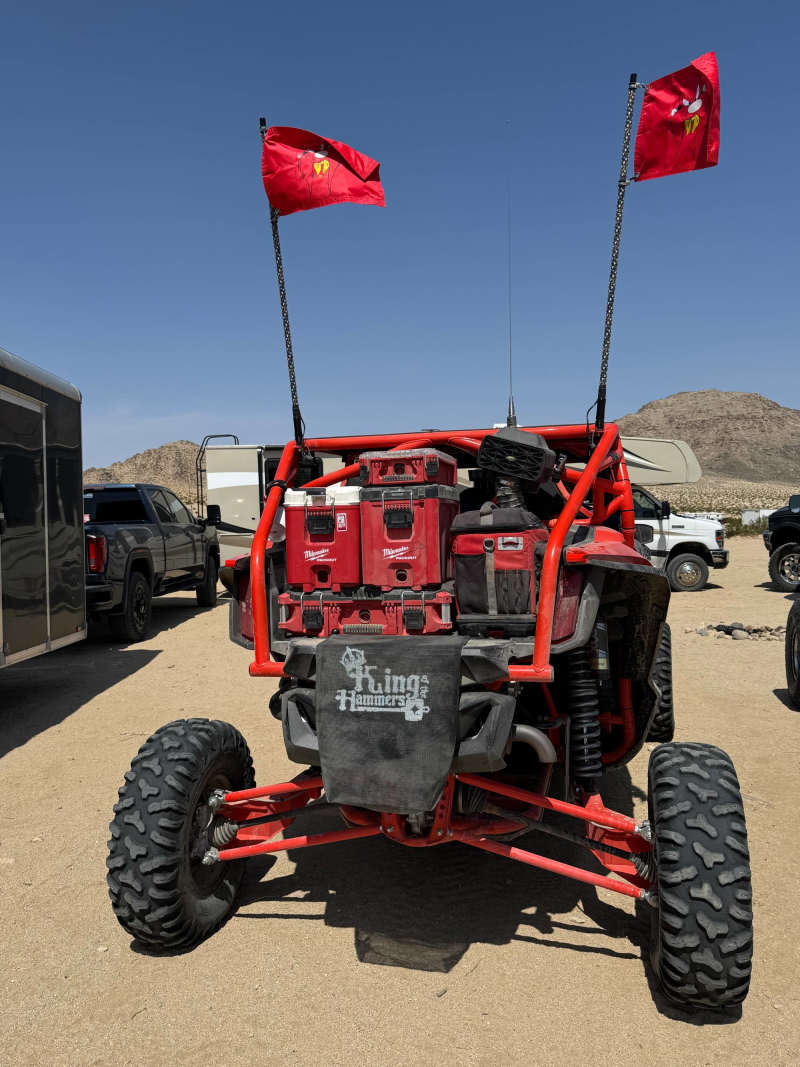 Customer photo: red flags on whips on a red side-by-side