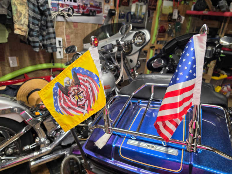 Customer photo: a custom flag and a USA flag on a motorcycle