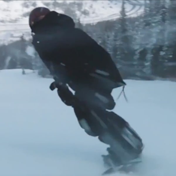 Louie Vito snowboarding down a mountain