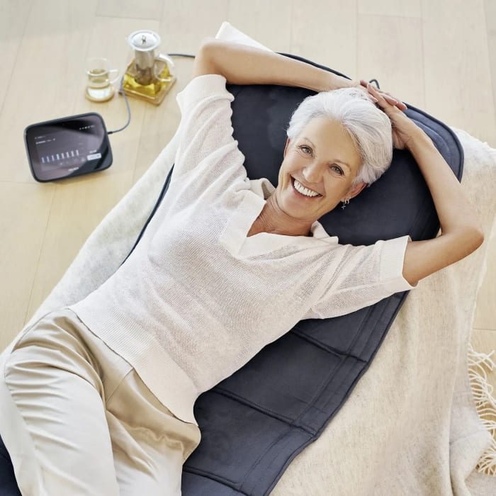 Smiling woman relaxing on the B.Body Evo