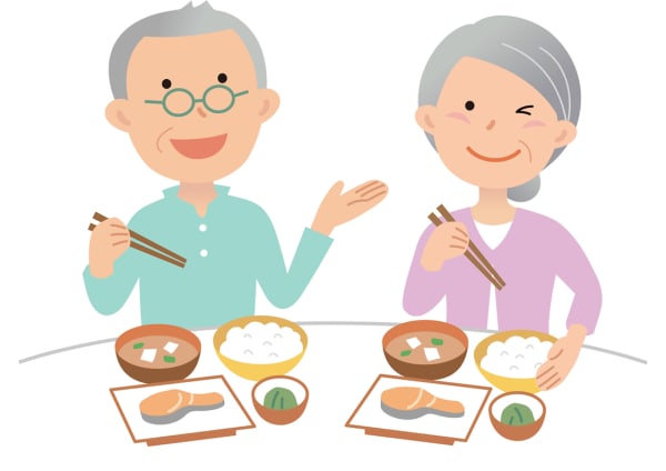 楽しく食事をとる高齢者