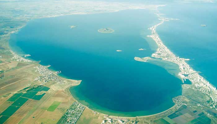 An aerial view of an ocean and coastline