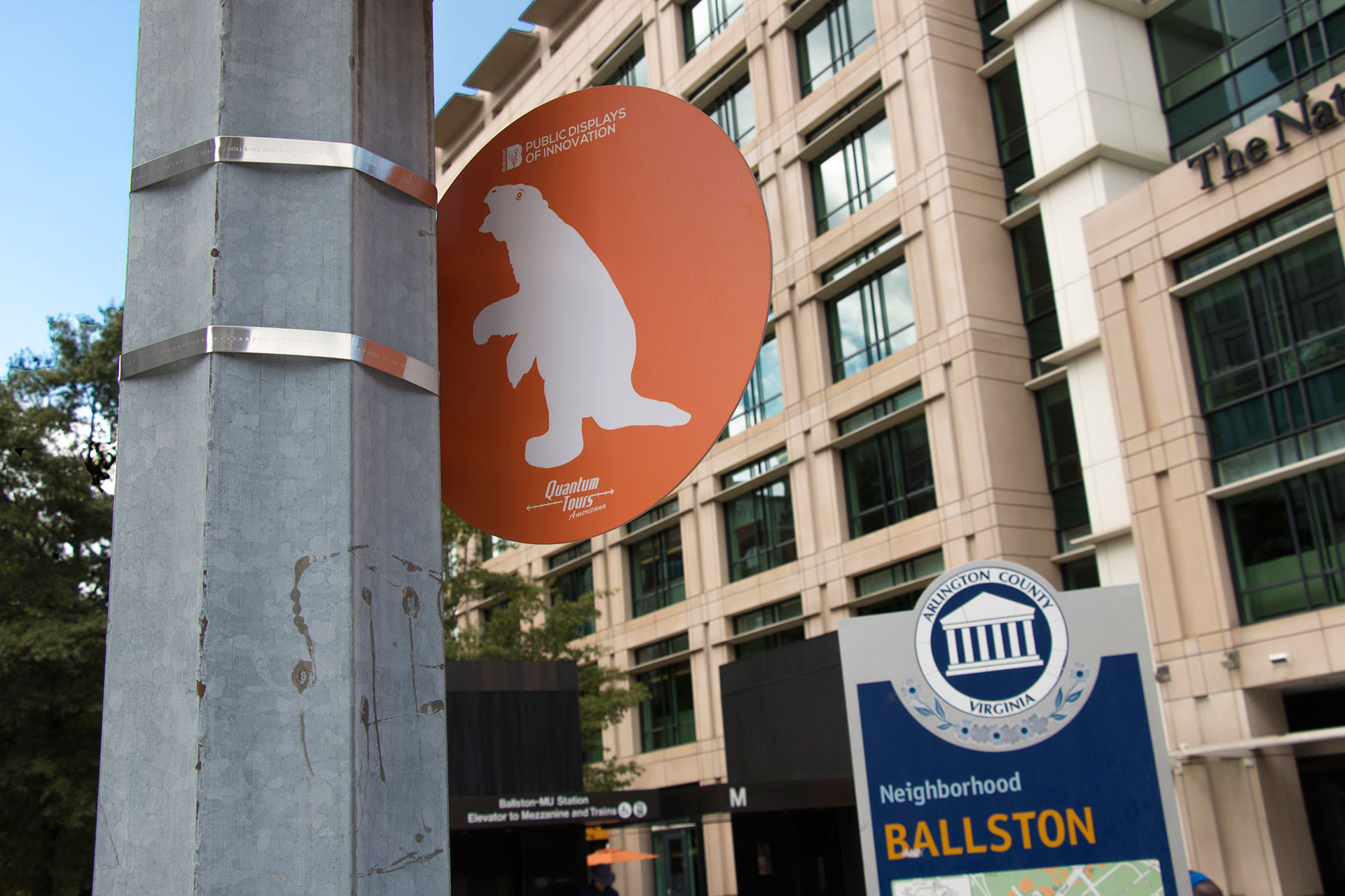 An orange sign with an icon of a giant ground sloth