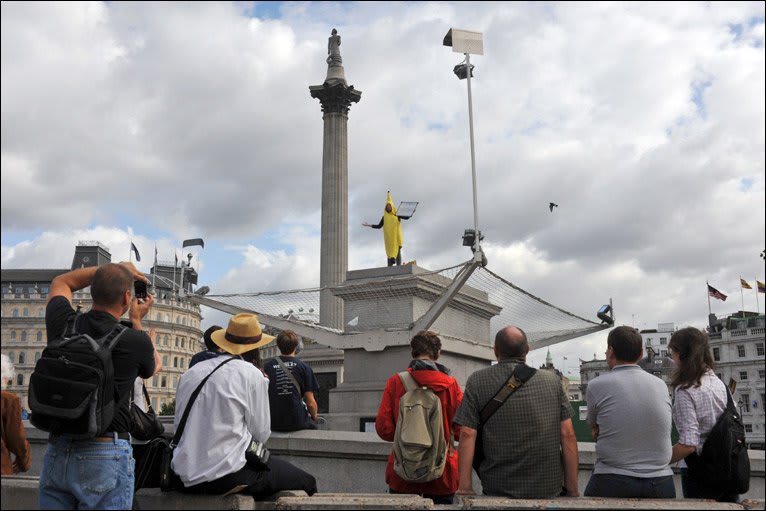 Person in banana suit above a crowd