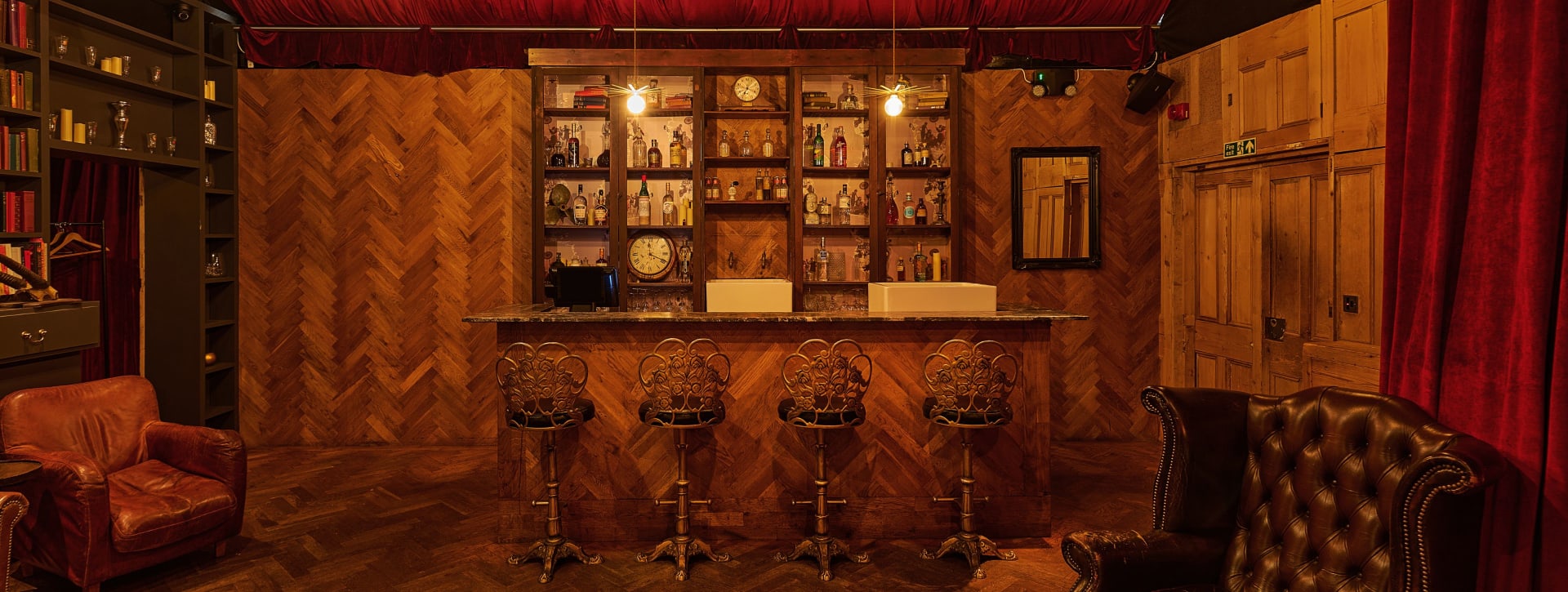 The Drawing Room at the BFI Southbank - A wooden clad bar with high streets in an apothecary style room