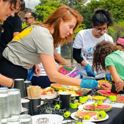 A lady at food event with children