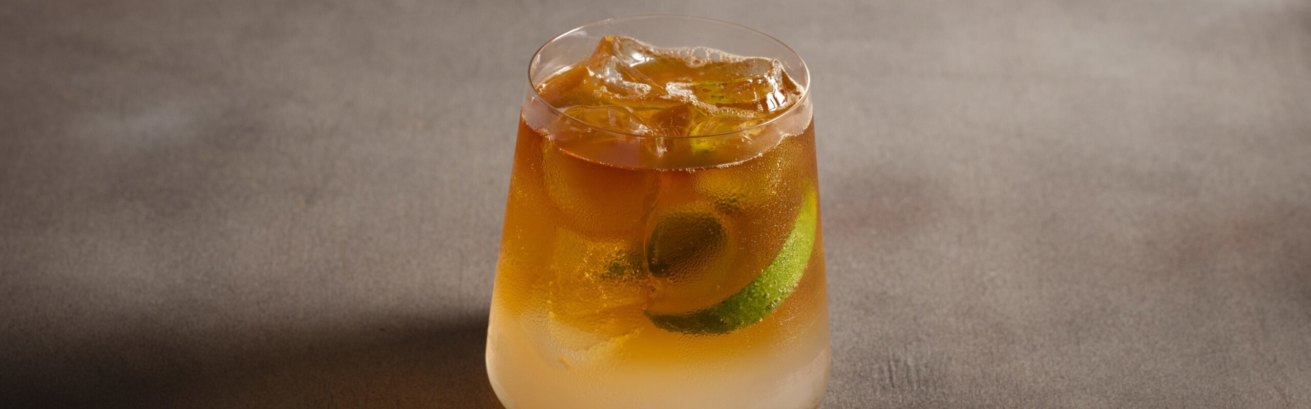Lime squeezed into cocktail