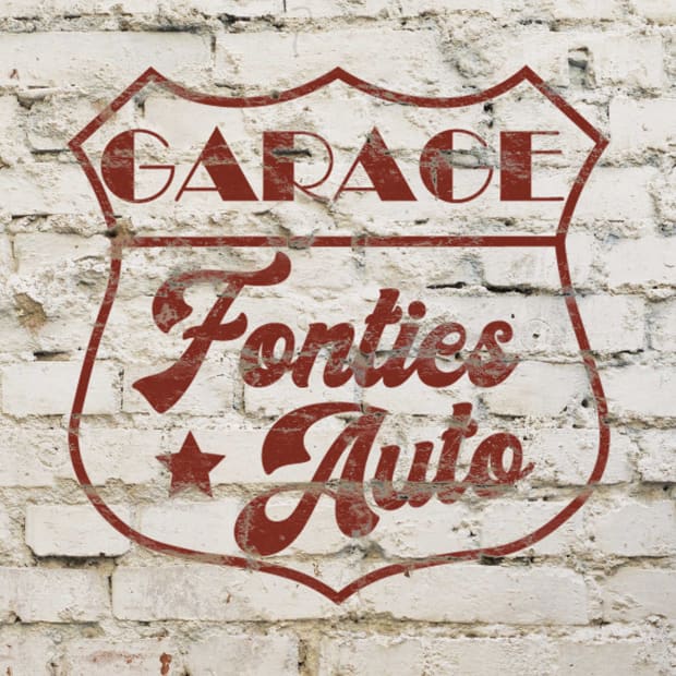 Fontiès Auto garage logo on a brick wall