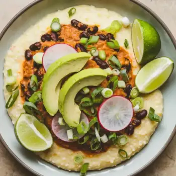 Creamy Cheese Grits with Spicy Black Beans & Fresh Avocado Radish Topping