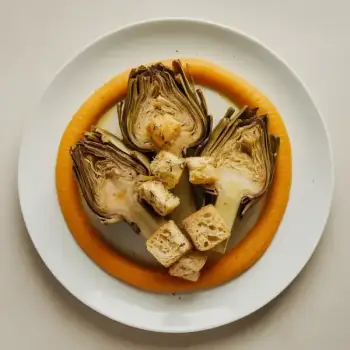 White Wine-Lemon Braised Artichokes with Celery Root and Carrot Purée, Topped with Herbed Croutons