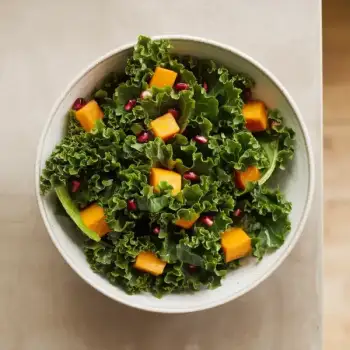 Kale Salad with Kabocha Squash, Toasted Hazelnuts, and Pomegranate Seeds