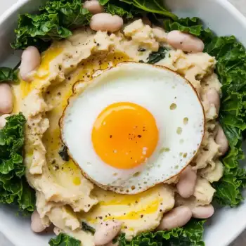 Creamy White Bean and Cheddar Mash with Crispy Kale and a Sunny-Side-Up Egg