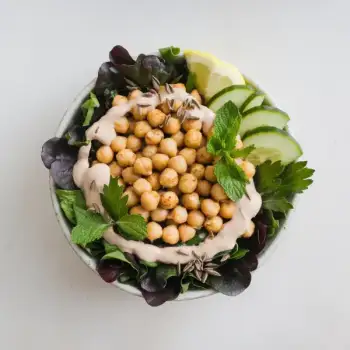 Cumin-Infused Chickpea and Greens Bowl with Creamy Tahini