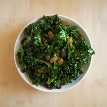 Green Kale Salad with Golden Raisins and Sherry Vinaigrette