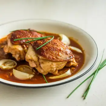 Braised Chicken Thighs with Harissa and Shallots