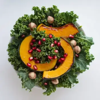 Kale Salad with Kabocha Squash, Toasted Hazelnuts, and Pomegranate Seeds